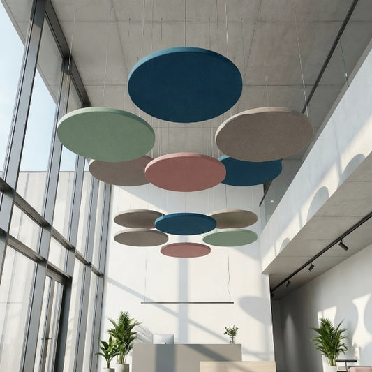 Circular ceiling rafts in a modern office setting with large windows.