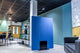 Modern office space with an acoustic grooved blue partition screen