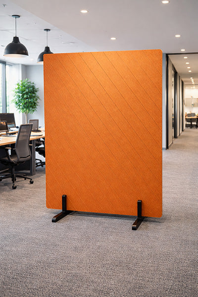 Orange partition screen in an office setting.