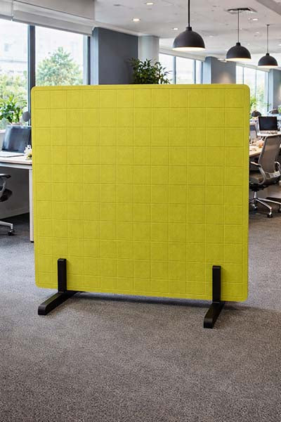 Olive Green grid partition acoustic screen in an office setting