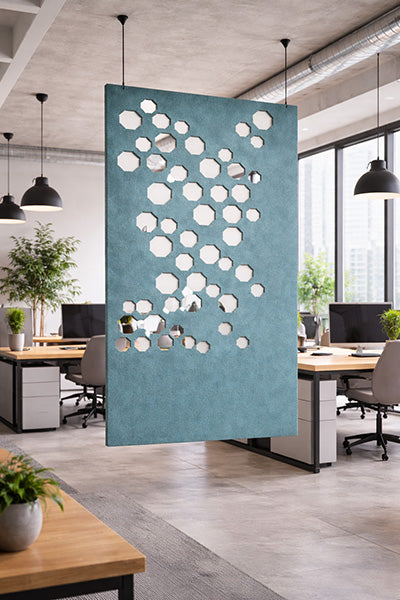 Decorative screen with circular cutouts from the Ocean Green acoustic range in an office setting