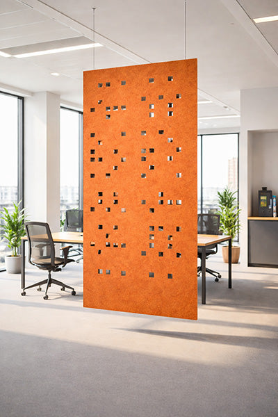 Orange decorative screen in an office setting with desks and chairs.