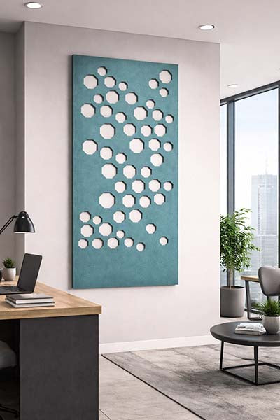 Modern office interior with a decorative Ocean Green acoustic wall panel featuring circular patterns.