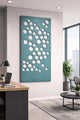 Modern office interior with a decorative Ocean Green acoustic wall panel featuring circular patterns.